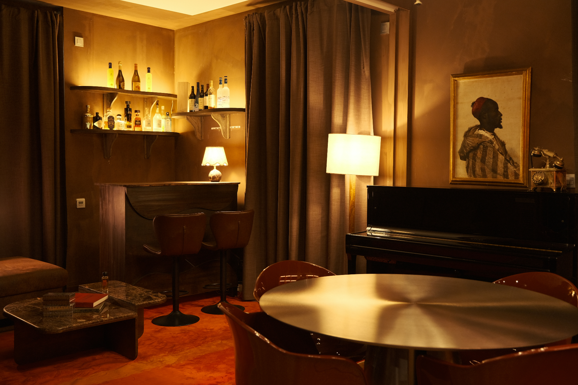 Special Affair lounge overview with bar nook, piano and orientalist portrait